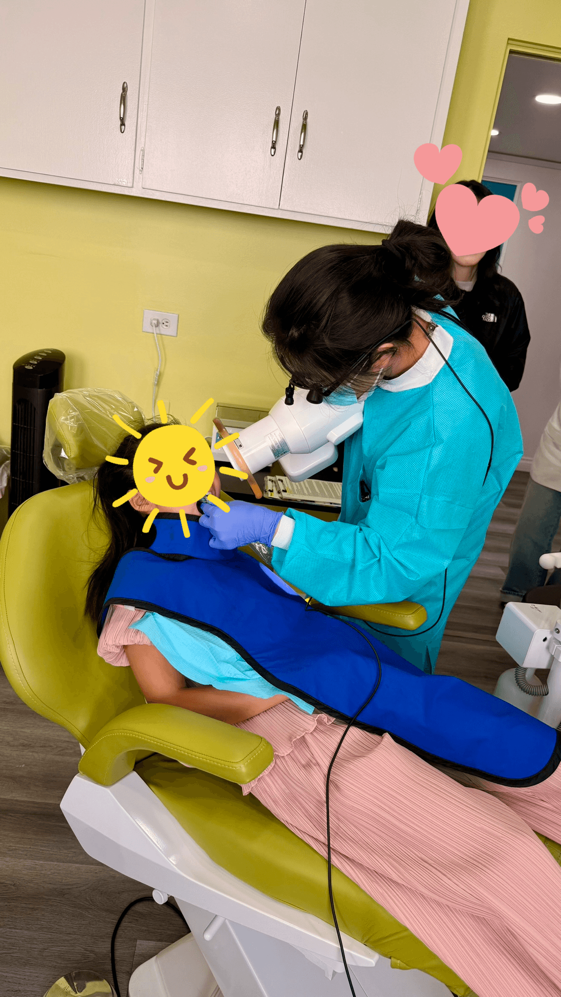 Dr. Kim gently treating a young patient at Kids Dental Story